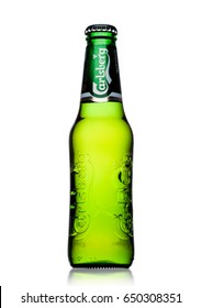 LONDON, UK - MAY 29, 2017: Bottle Of Carlsberg beer on white background. Danish brewing company founded in 1847.