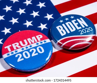 London, UK - May 5th 2020: Donald Trump and Joe Biden pin badges, pictured of the USA flag.  The two men will be battling eachother in the 2020 US Presidential Election.