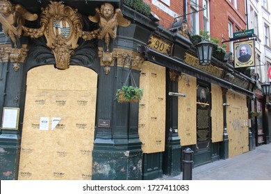 London / UK - May 8 2020: Boarded Up Pub In Covent Garden, Central London -taken During Covid 19 Lockdown