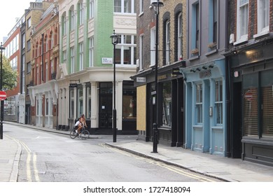 London / UK - May 8 2020: Quiet Central London - Cyclist In Lexington Street In Soho Taken During Covid 19 Lockdown