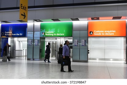 LONDON, UK - NOV 18, 2015: Air Travellers Pass Through Customs Channels At Heathrow Airport. The UK's Main Aviation Hub Is The Busiest Airport In Europe By Passenger Traffic.