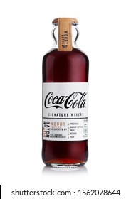 LONDON, UK - NOVEMBER 08, 2019: Glass Bottle Of Coca Cola Woody Notes Signature Mixers On White.