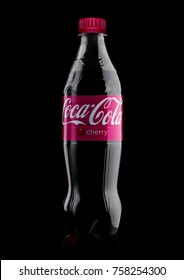 LONDON, UK - November 17, 2017:  Bottle Of Cherry Coca-Cola On Black Background. Coca-Cola Is One Of The Most Popular Soda Products In The World.