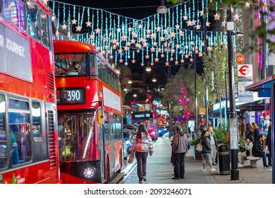 London UK - November 18, 2021:  Festive Decorations And Christmas Lights At Oxford Street, Cars, Buses And People Walking On The Street. London's Night Life 