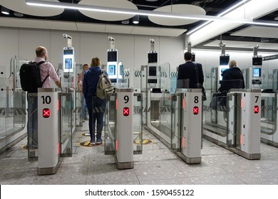 London, UK - November 19, 2019: Air Travellers Pass Through Automated Passport Border Control Gates At Heathrow Airport. Heathrow And UK Border Force Use Facial Recognition Technology.