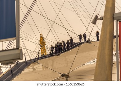 London, UK - November 2019: O2 Arena, People Climbing To The Top Of The Dome