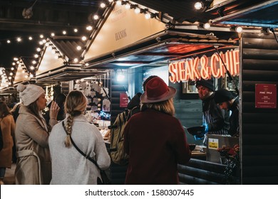 London, UK - November 24, 2019: People Order Food From Steak & Chips Stall At Southbank Centre Winter Market, An Outdoor, Global Street Food Market, Focused On Sustainable And Artisan Produce.