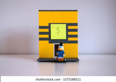 London, UK, November 24th: An Improvised Lego Structure Of Uncle Scrooge's Money Bin. Uncle Scrooge Figurine Standing In Front Of The Bin.