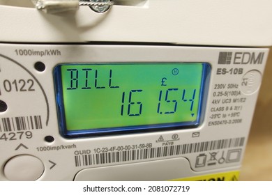 London UK, November 25th 2021: A Modern Smart Meter, Measuring Electricity Consumption. LCD Display Showing Current Bill. Concept For Cost Of Living, Meter Reading, High Bills, Price Rise, Inflation.