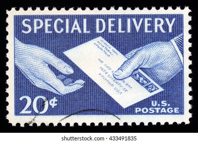 London, UK, November 27 2010 - Vintage 1954-1957 United States Of America Cancelled Postage Stamp With An Engraving Of A Postal Worker Delivering A Special Delivery Envelope