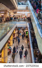 LONDON, UK - NOVEMBER 29, 2014:  Westfield Stratford City Shopping centre  with lots of people rushing for Christmas sale. 