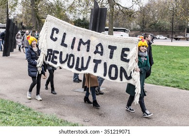 London, UK - November 29 2015: Two Girls Carrying A Big Billboard With The Words 