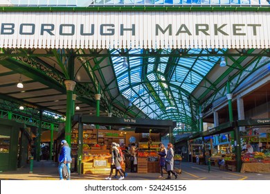 London, UK - November 7, 2016 - Tourists and food stalls at Borough Market