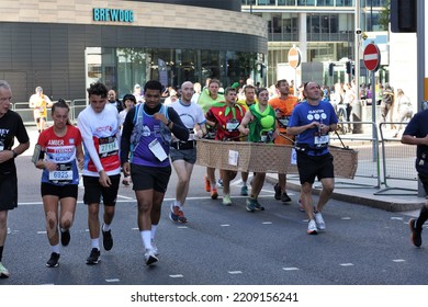 London, UK - Oct 02 2022: London Marathon. Runners At Canary Wharf