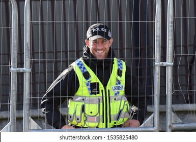 London, UK. Oct 19 2019. A Friendly Armed Police Officer Outside The House Of Commons As MPs Sit For A Rare Saturday Session To Discuss The Latest Proposed Brexit Deal While Protests Take Place Nearby