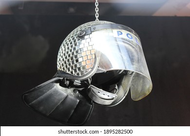 London, UK - Oct 4, 2019: shop Met ball ; disco ball made from police riot helmet Art on display by Banksy at the street artist's Gross Domestic Product shop temporary showroom in Croydon, London. UK