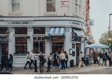 London, UK - October 09, 2021: The Real Greek Restaurant On A Street In Covent Garden, A Famous Tourist Area In London With Lots Of Shops And Eateries, People Outside.