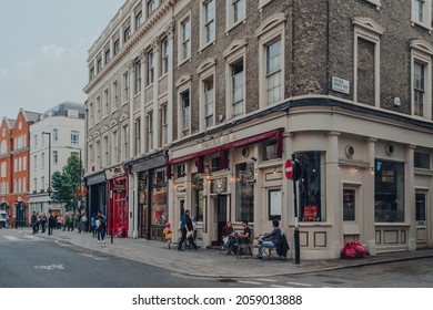 London, UK - October 09, 2021: Row Of Restaurants On A Street In Covent Garden, A Famous Tourist Area In London With Lots Of Shops And Eateries, People Outside.