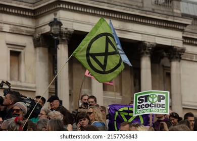 London, UK. October 16th, 2019. Extinction Rebellion flag and logo, an hourglass in a circle, seen at a demonstration by Extinction Rebellion protesters on Trafalgar Square.
