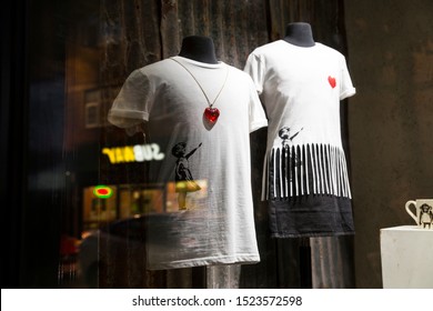 London, UK - October 2, 2019: Balloon Tee and Shredded Tee, Art on display by Banksy at the street artist's Gross Domestic Product temporary showroom in Croydon, South London. 