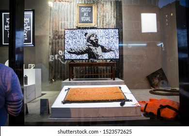 London, UK - October 2, 2019: Art on display by Banksy at the street artist's Gross Domestic Product temporary showroom in Croydon, South London. 