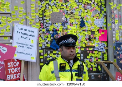 London, UK - October 20, 2018 - Police officer standing in front of Prime Ministry's Office at the People's Vote march