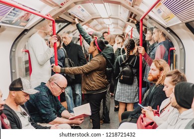 London, UK - October 21st, 2018; Random People Travelling By Underground Train On The Central Line, TFL.