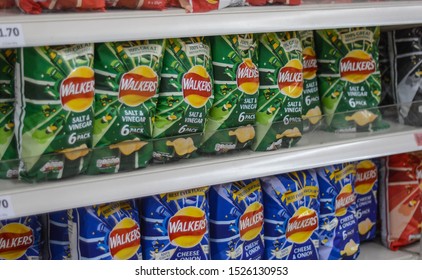 London, UK, October 7, 2019:  Big Packages Of Walkers Crisps On Shelf In Supermarket 