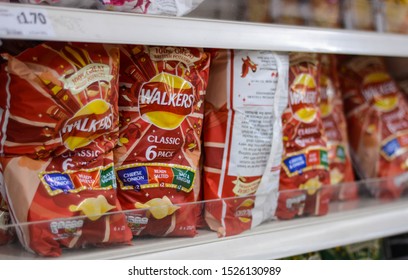 London, UK, October 7, 2019:  Big Packages Of Walkers Crisps On Shelf In Supermarket 