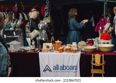 London UK - October 9, 2021: The Classic Car Boot Sale Event At Kings Cross. People Buying And Selling Vintage Fashion, Accessories, And Homeware Traders Operating From The Boot Of Vintage Vehicles.