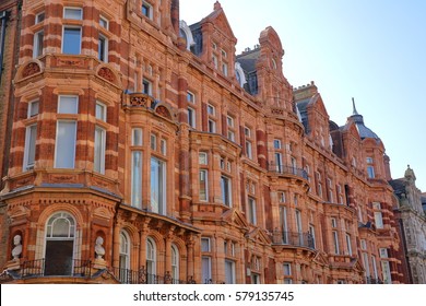 LONDON, UK: Red brick Victorian houses facades in Mount Street (borough of Westminster)