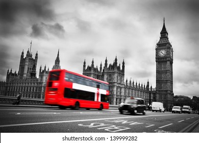 London, the UK. Red bus in motion and Big Ben, the Palace of Westminster. The icons of England