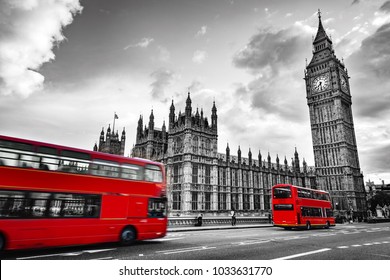 London, the UK. Red buses in motion and Big Ben, the Palace of Westminster. The icons of England in vintage, retro style. Red in black and white - Shutterstock ID 1033631770