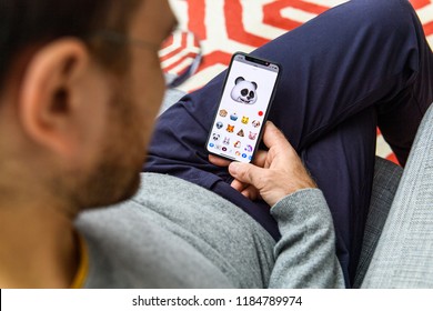 LONDON, UK - SEP 21, 2018: Man Using The New Panda AR Memoji Emoji Face On Apple IPhone Xs With The Immense OLED Retina Display And A12 Bionic Chip