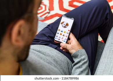 LONDON, UK - SEP 21, 2018: Man Using The New Astonished Dog Pet AR Memoji Emoji Face  On Apple IPhone Xs With The Immense OLED Retina Display And A12 Bionic Chip, With The Face 