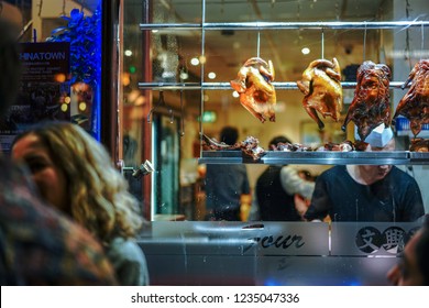 London, UK - Sept. 2018: Crispy Duck Restaurant Store Front In China Town, Soho London. Fried Duck, Chicken And Pork Hanging.