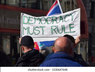 London, UK. Sept 25 2019. A Pro Brexit, Protest Sign Held By Demonstrators In Westminster Outside The British Houses Of Parliament That Reads “Democracy Must Rule”