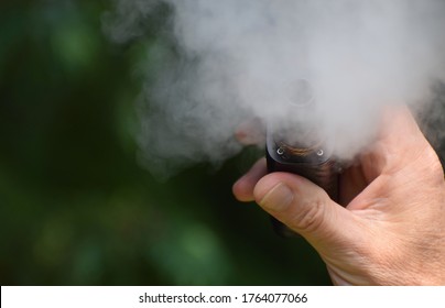 London, UK. Sept 26 2020. A Man Vaping His Hand In Close Up Holding An E Cigarette / Mod. This Week Florida Saw A Spike In Teenage Vaping Related Hospitalisations And Lung Disease Not Related To Covid