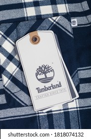 LONDON, UK - SEPTEMBER 09, 2020:Timberland Logo And Clothing Tag On Black And White Wool Shirt Fabric.