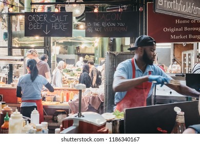 London, UK - September 17, 2018: Staff Preparing Food At Northfield Butchery Market Stand In Borough Market, One Of The Largest And Oldest Markets In London, UK.