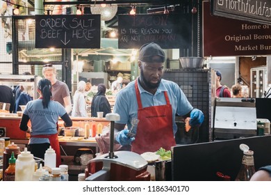 London, UK - September 17, 2018: Staff Preparing Food At Northfield Butchery Market Stand In Borough Market, One Of The Largest And Oldest Markets In London, UK.