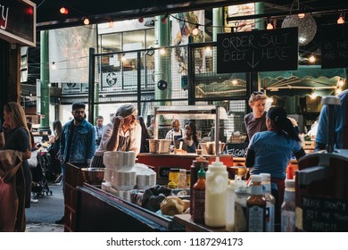 London, UK - September 17, 2018: Staff Preparing Food At Northfield Butchery Market Stand In Borough Market, One Of The Largest And Oldest Markets In London, UK.