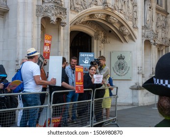 LONDON, UK - SEPTEMBER 17 2019: Protesters And Police Gather Outside The Supreme Court In Westminster Awaiting The Court Ruling On Suspension Of The British Parliament