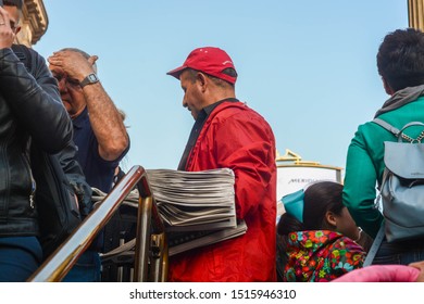 London, UK, September 18, 2019: The Newspaper Man Delivery The Evening Standard At The Entrance Of The Tube Station 