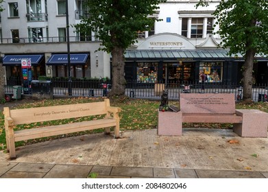 London, UK - September 28th 2021: Park Bench Dedicated To Homeless People Next To A Memorial For A Street Cat Named Bob