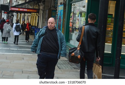London, UK, September 30, 2019: Obese Man Walking On The Street. Obesity Become A Serious Illness In Our Days 
