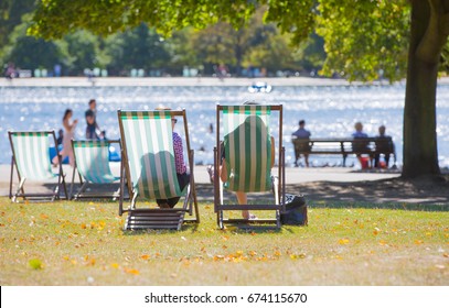 London, UK - September 8, 2016: Hyde Park  Serpentine Man Made Lake And Lots Of People Walking And Reacting In The Park