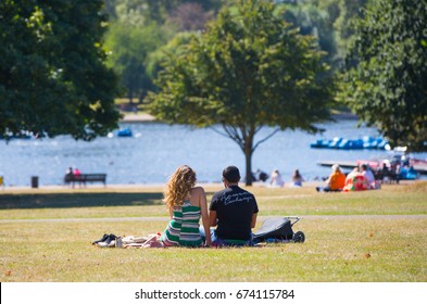 London, UK - September 8, 2016: Hyde Park  Serpentine Man Made Lake And Lots Of People Walking And Reacting In The Park