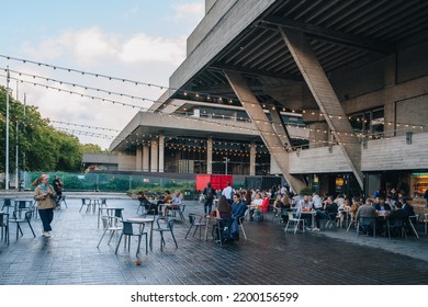 London, UK - September 8, 2022: People At The Outdoor Tables Of A The Understudy Bar In National Theatre On South Bank, An Area Beside The River Thames Famous For Theatres.