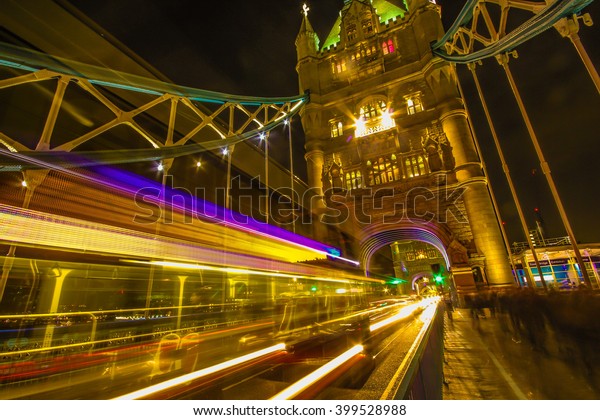 London UK - Tower Bridge - in the night - long\
exposure. Tower bridge in London UK illuminated at night with car\
passing lights. Long\
exposure.